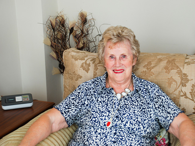 Elderly Lady wearing her personal alarm